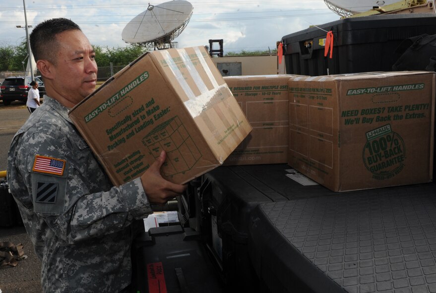 Sgt. 1st Class Phong Le, Vietnamese Linguist for Joint POW/MIA Accounting Command, places boxes of burn cream on a pallet July 22, 2014, at Joint Base Pearl Harbor-Hickam, Hawaii. A shipment of 164 jars of burn cream, for Vietnamese soldiers critically injured in a helicopter crash, are scheduled to arrive July 26 in Dinang, Vietnam, aboard a C-17 Globemaster III, from the 15thWing at JBPH-Hickam. (U.S. Air Force photo/Master Sgt. Matthew McGovern) 