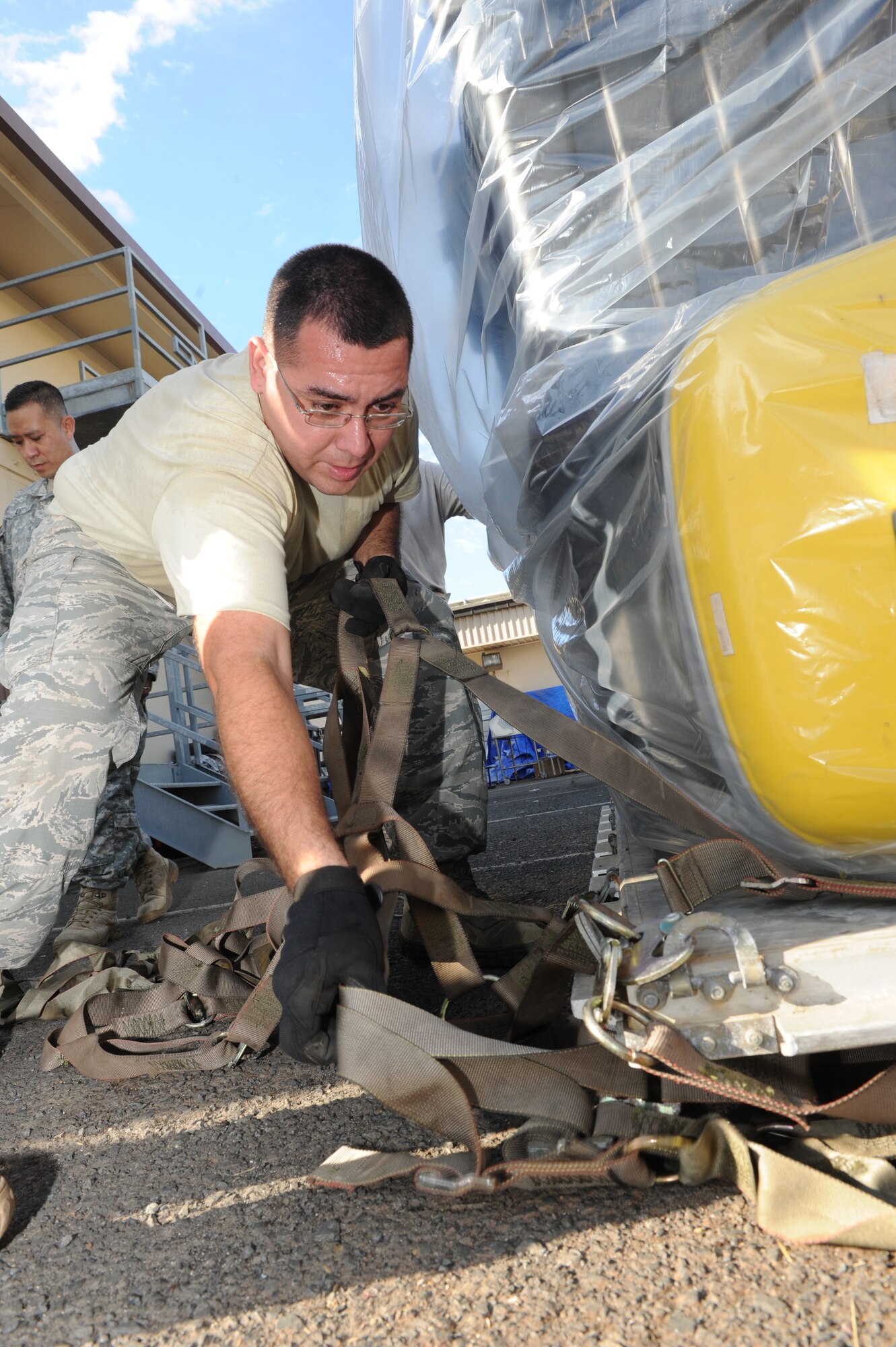 Army Staff Sgt. Gaston Dorador, Joint POW/MIA Accounting Command, prepares a pallet containing burn cream July 22, 2014, at Joint Base Pearl Harbor-Hickam, Hawaii. A shipment of 164 jars of burn cream, for Vietnamese soldiers critically injured in a helicopter crash, are scheduled to arrive July 26 in Dinang, Vietnam, aboard a C-17 Globemaster III, from the 15thWing at JBPH-Hickam. (U.S. Air Force photo/Master Sgt. Matthew McGovern)
