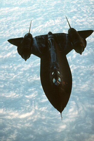 A SR-71 Blackbird soars above clouds.  The Blackbird was developed in secrecy by Lockheed's Skunk Works division in Palmdale, Calif. Aerospace engineer Clarence "Kelly" Johnson was responsible for many of the aircraft's innovative concepts. (Courtesy photo)