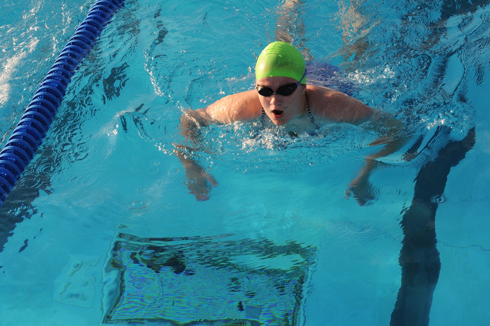 Bella Calabrese works on her butterfly stroke at Scott Air Force Base, Ill., July 16, 2014.  The breaststroke, a popular stroke among swimmers, is swum in on the stomach, with both arms moving synchronously and executing short, half-circular movements underwater. The legs also move synchronously and execute a whip kick.   At a competition level, breaststroke swimmers will have to have endurance and strength to move quickly.  Calabrese is a swimmer for the Scott Sharks.  (U.S. Air Force photo by Staff Sgt. Maria Bowman)