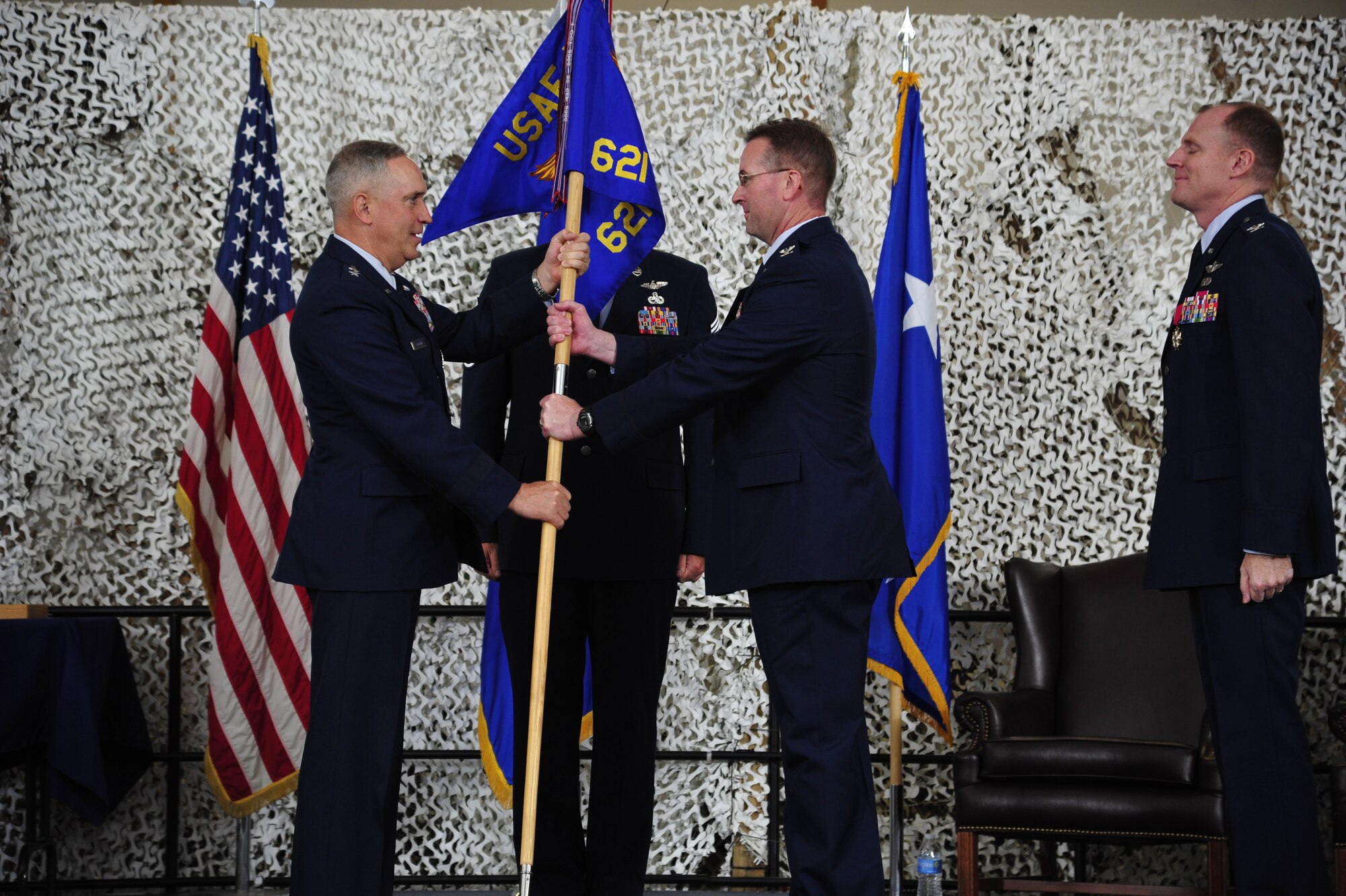 JOINT BASE MCGUIRE-DIX-LAKEHURST, N.J. – Col. James A. Copher receives the 621st Contingency Response Wing guidon from Major Gen. Fredrick Martin, commander of the U.S. Air Force Expeditionary Center during the wing change of command ceremony at Joint Base McGuire-Dix-Lakehurst, N.J., July 24, 2014. Copher served as the vice wing commander of the 380th Air Expeditionary Wing in Southwest Asia. (U.S. Air Force photo by Tech. Sgt. Parker Gyokeres)
