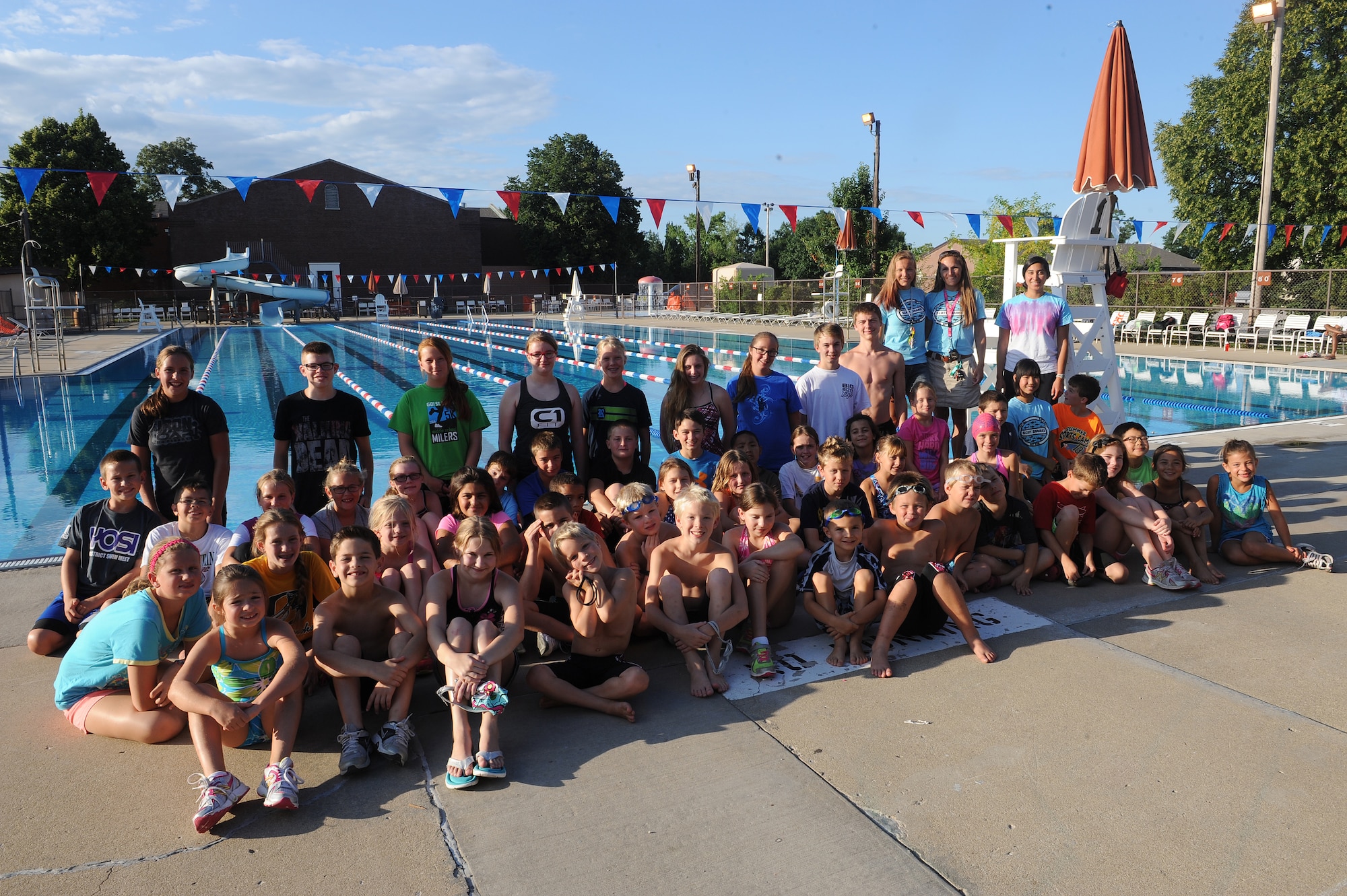 Sharon Wilda and her daughter, Brittany, coach 50 swimmers for the Scott Sharks at Scott Air Force Base, Ill., July 16, 2014.  Together, the teach children 5-18 years old how to swim freestyle, butterfly stroke, back stroke, and breast stroke.  During the summer, practice was held twice a week, and swimmers would compete in individual and team competitions during the weekend.  (U.S. Air Force photo by Staff Sgt. Maria Bowman)