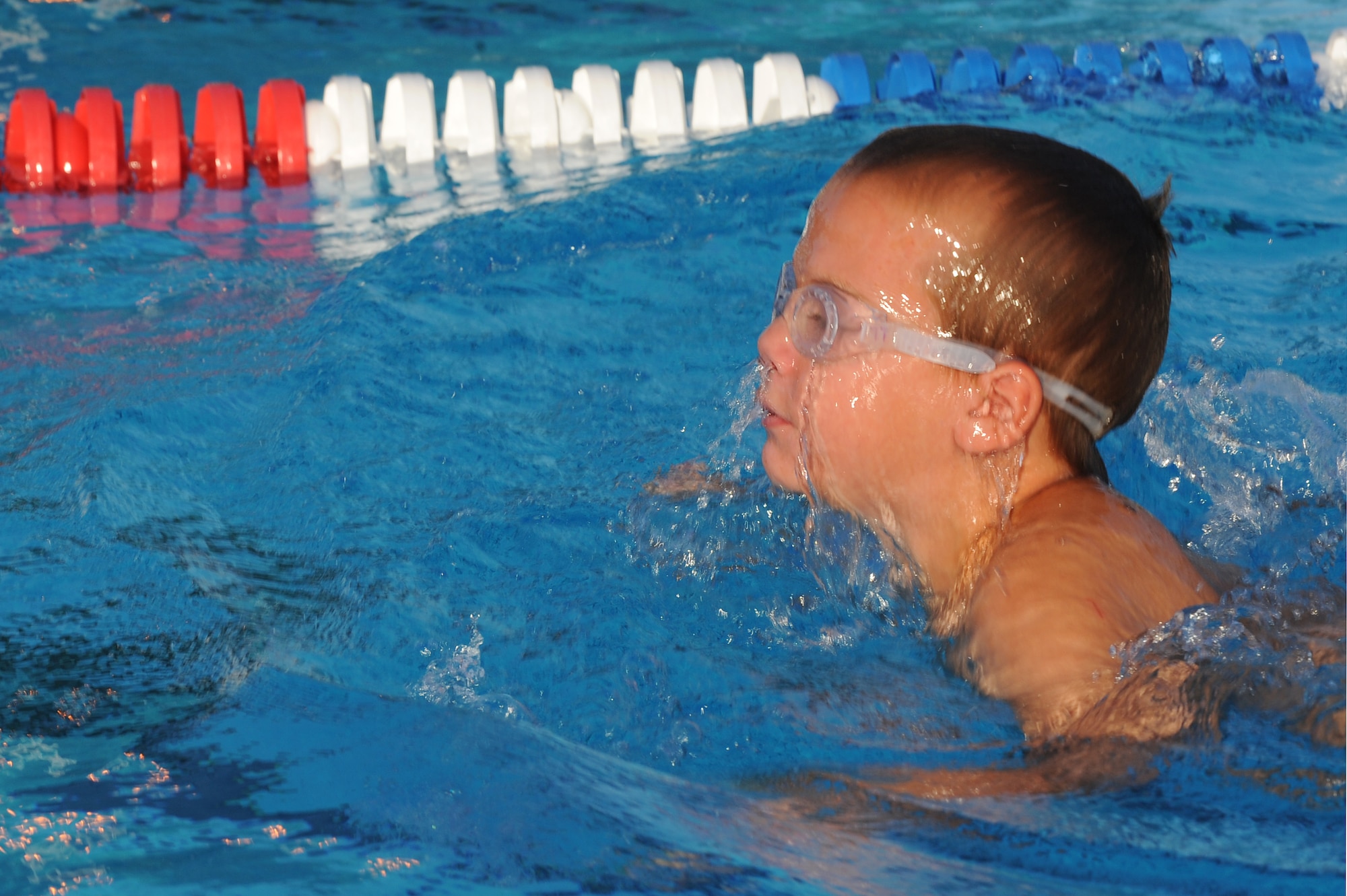 Luke Litteken practices the breaststroke during a swim practice at Scott Air Force Base, Ill., July 16, 2014.  The breaststroke is swum in on the stomach, with both arms moving synchronously and executing short, half-circular movements underwater. The legs also move synchronously and execute a whip kick. Litteken is a swimmer for the Scott Sharks. (U.S. Air Force photo by Staff Sgt. Maria Bowman)