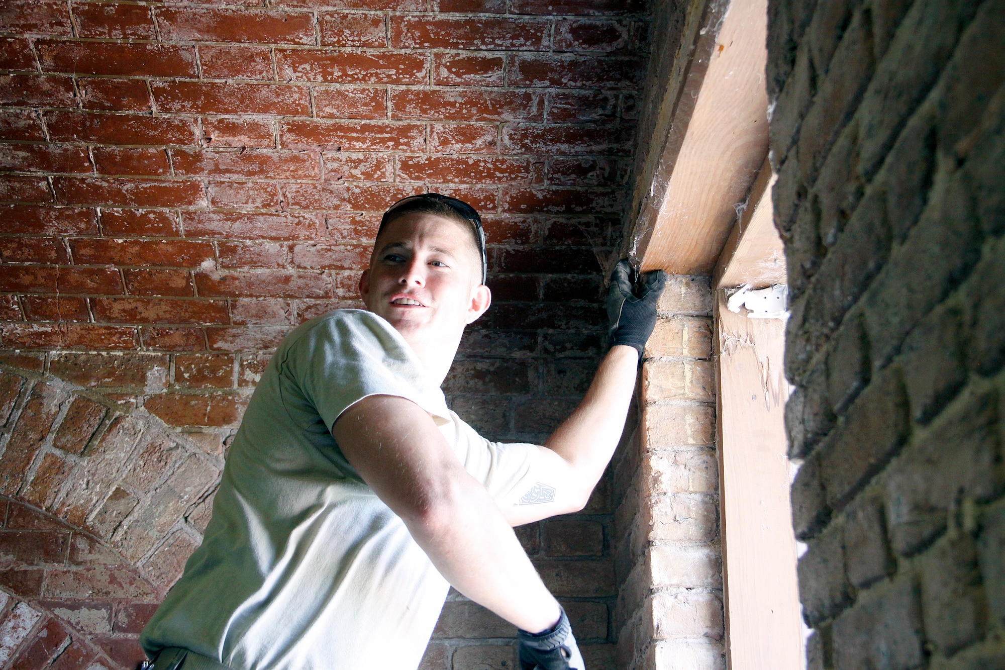 Staff Sgt. John Hopkins, an electrician with the 482nd Civil Engineering
Squadron, Homestead Air Reserve Base, Fla., takes a break from extracting a stubborn nail at the Dry Tortugas National Park, Fla., July 17. As a traditional reservist, Hopkins learned valuable training while working with former members of the squadron to help
restore and improve living conditions at the park. (U.S. Air Force photo/Maj. Brooke Cortez)