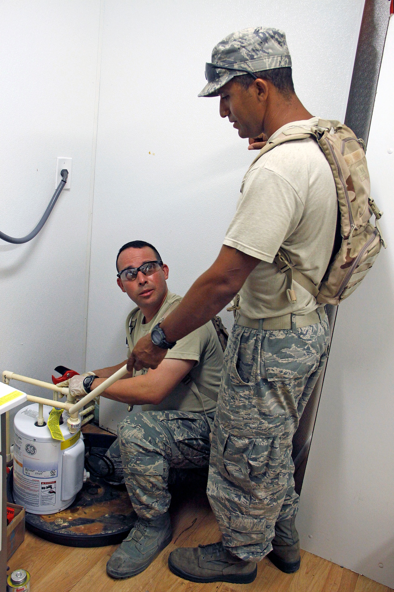 Staff Sgt. Tony Guzman and Tech. Sgt. Renne Montilla, both members of the
482nd Civil Engineer Squadron, Homestead Air Reserve Base, Fla., work to install plumbing to improve living conditions for National Park Service personnel at the Dry Tortugas National Park, Fla., July 17. While performing their annual tour duties, civil engineers partnered with the National Park Service and accomplished training
requirements for the Air Force Reserve while improving living conditions at
the park. (U.S. Air Force photo/Maj. Brooke Cortez)