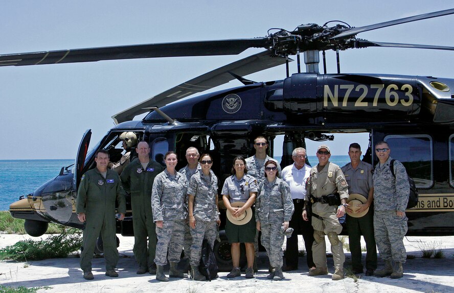 After touring the Dry Tortugas National Park, Fla., and viewing projects
482nd Civil Engineering Squadron troops are working on, members from the
U.S. Customs and Border Protection, National Park Service and 482nd Fighter
Wing pause for a photo in front of the CBP Black Hawk UH-60 helicopter July
17. (U.S. Air Force photo)
