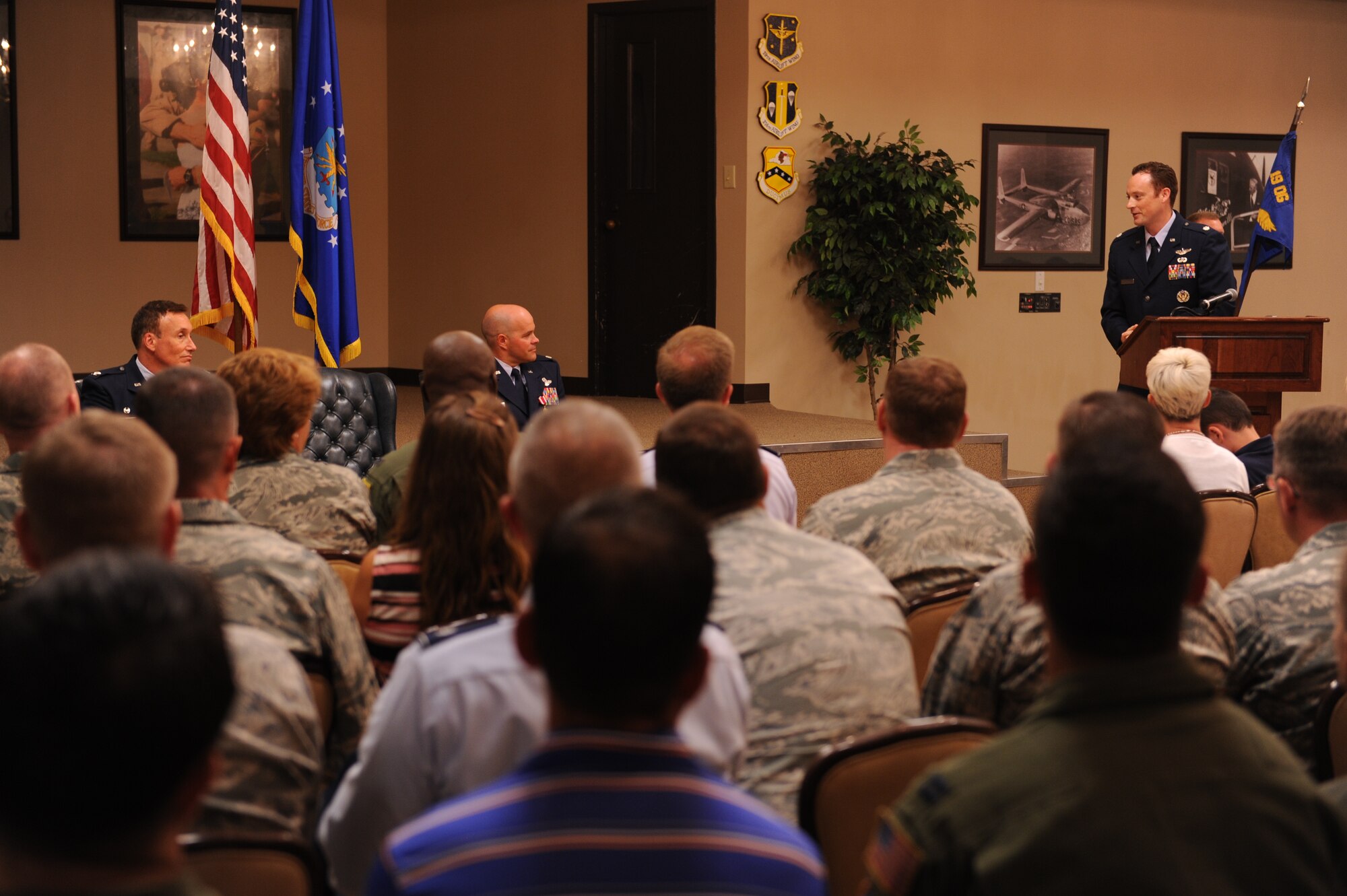 Lt. Col. Brown Daniel Brown, Operations Support Squadron commander, gives thanks to Col. Kelley Kirby, 19th Operations Group deputy commander, and outgoing commander July 7, 2014, at Little Rock Air Force Base, Ark. (U.S. Air Force photo by Airman 1st Class Cliffton Dolezal) 