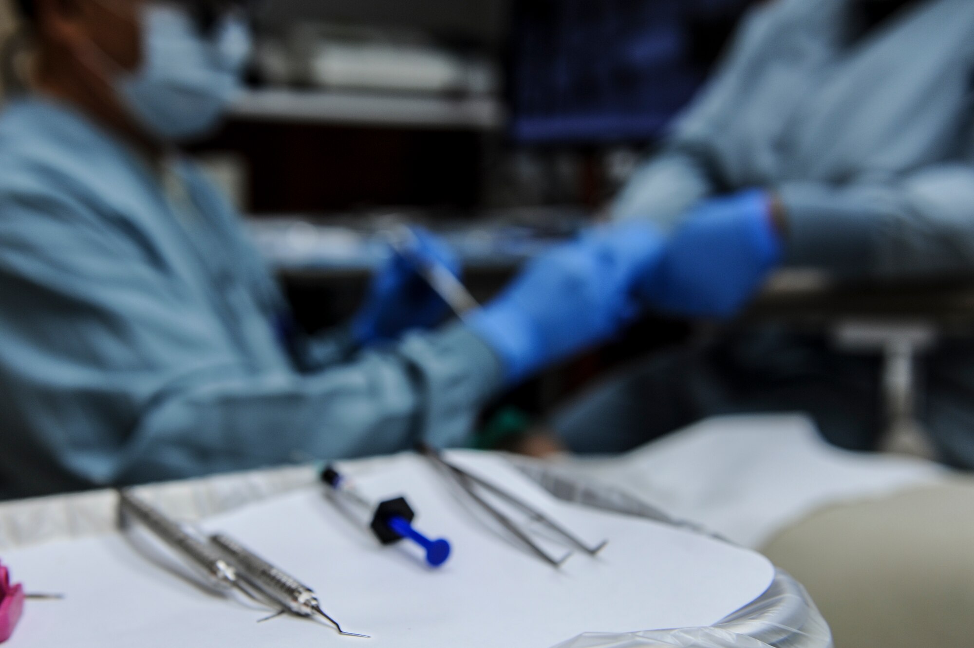Airmen from the 19th Medical Group dental clinic fill a cavity July 10, 2014, at Little Rock Air Force Base, Ark. The Dental Clinic is responsible for keeping the Air Force fit-to-fight by expertly examining, diagnosing and treating diseases in the oral cavity. (U.S. Air Force photo by Airman 1st Class Cliffton Dolezal)