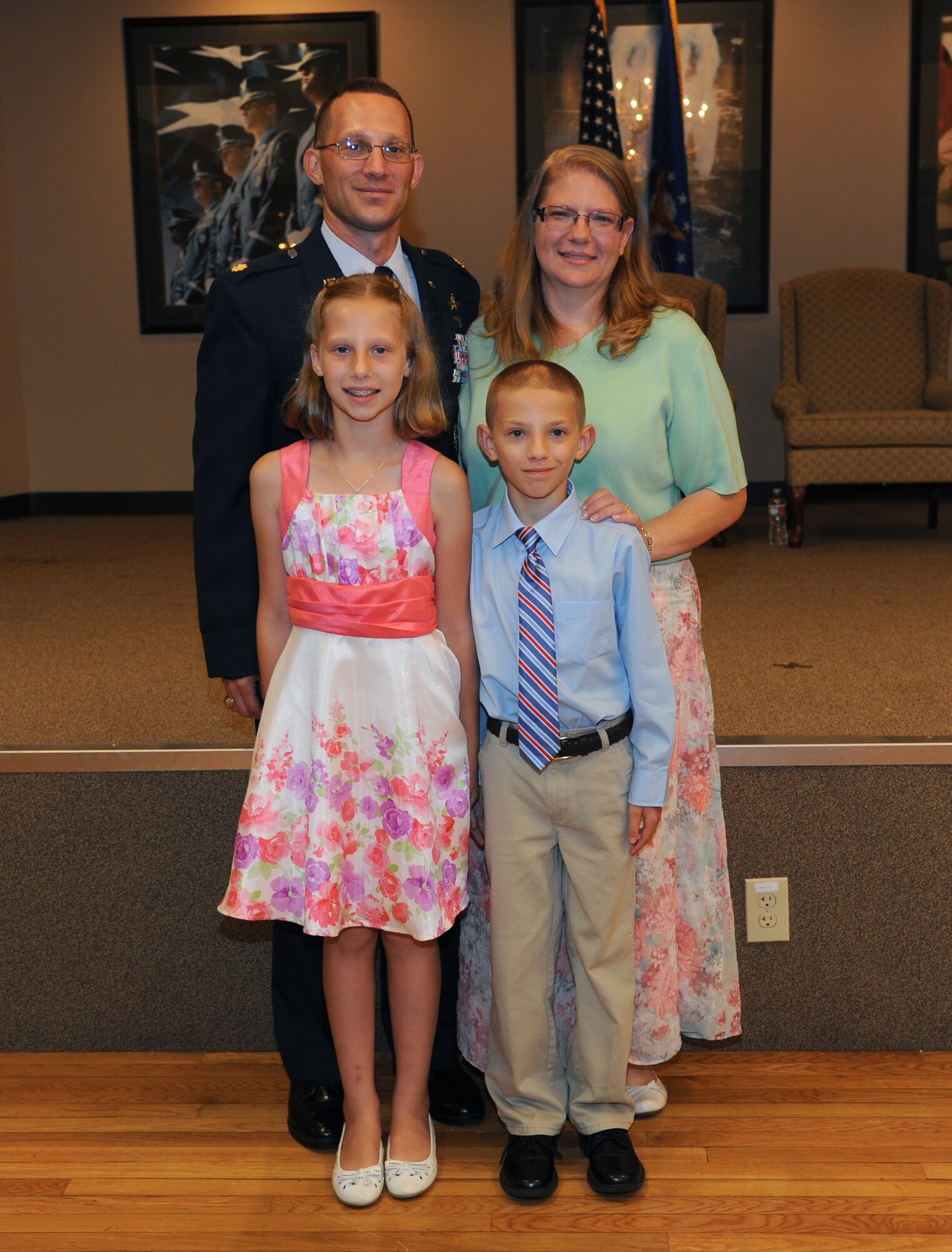 The Henderson family poses for a photo after the 19th Communications Squadron change of command July 14, 2014, at Little Rock Air Force Base, Ark. (U.S. Air Force photo by Senior Airman Kaylee Clark) 