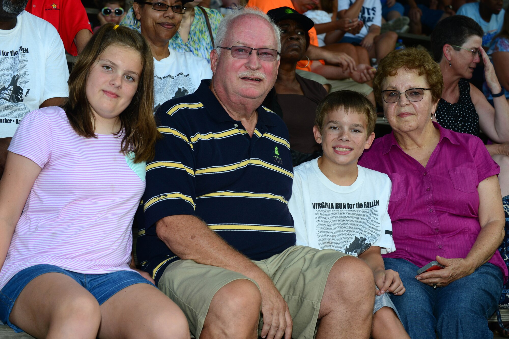From left, Eniale Matheny, Richard Reynal, Derrik Matheny and Judy Reynal, family members of the late U.S. Army Sgt. Caryn Nouv who was killed in action July 27, 2013, attended the Peninsula Pilots baseball team’s 2nd Annual Gold Star Family Appreciation Night in Hampton, Va., July 23, 2014. The family has used the Fort Eustis Gold Star Family program’s services to help with the healing process after their loss. (U.S. Air Force photo by Airman 1st Class Kimberly Nagle/Released)