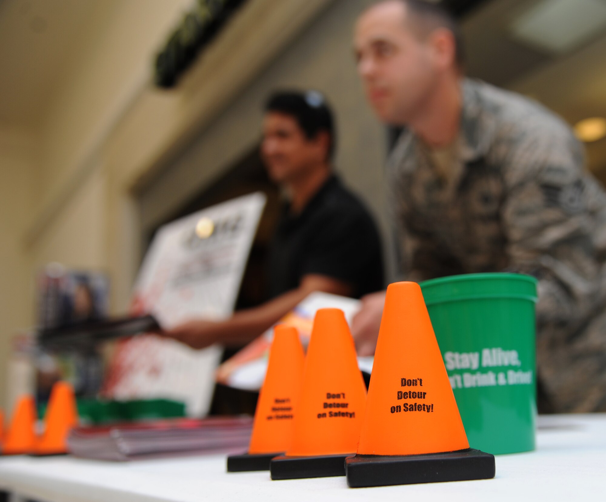 Erwin Urias, “Globe of Death” motorcycle performer, and Staff Sgt. Thomas Northcutt, 81st Training Wing, provide information about traffic safety July 23, 2014, at the base exchange, Keesler Air Force Base, Miss.  The wing safety office hosted the traffic safety day event which included information about the Airmen Against Drunk Driving program and motorcycle safety tips.  (U.S. Air Force photo by Kemberly Groue)