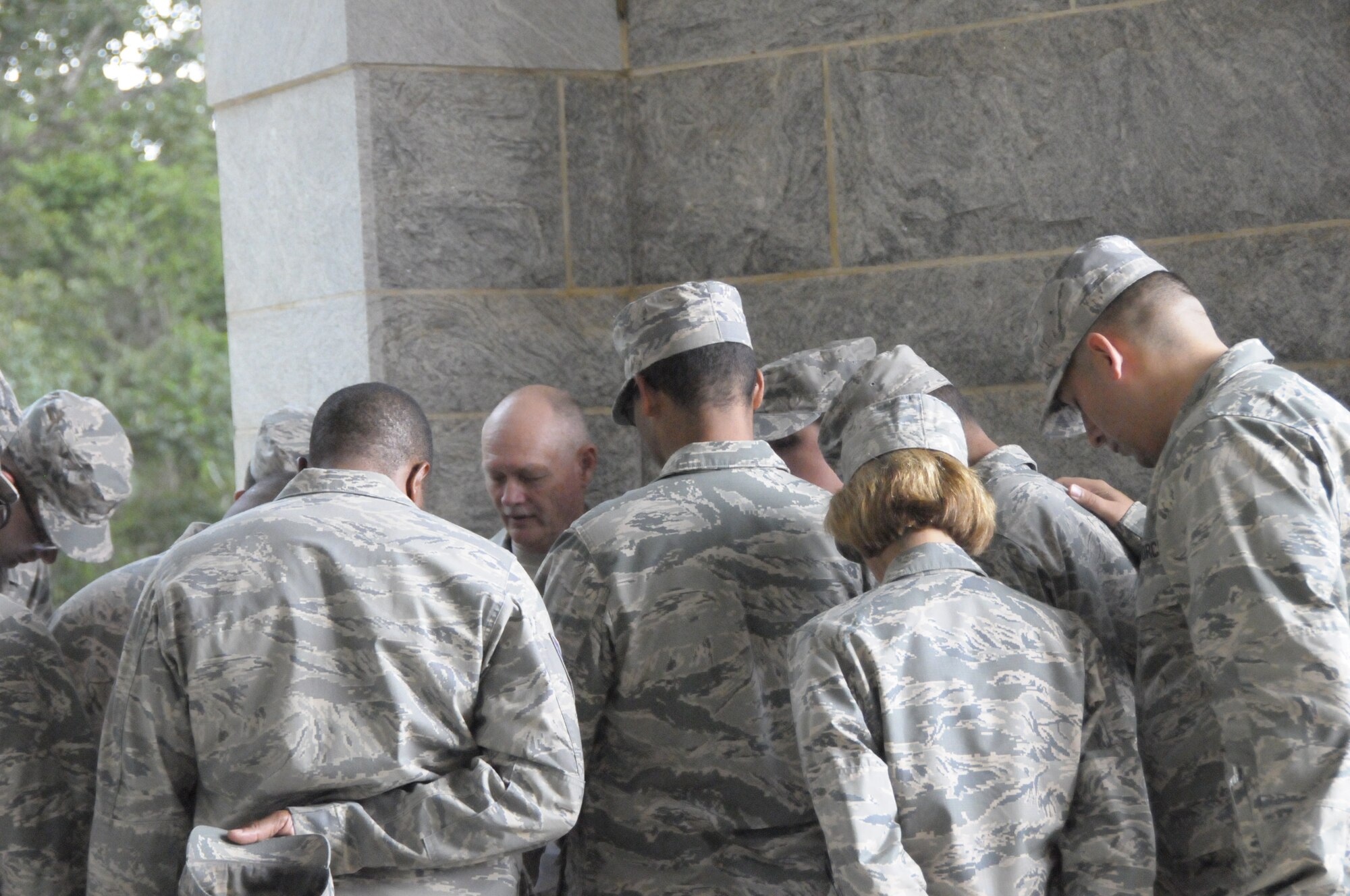 Master Sgt. Jackie Kirkwood, 307th Bomb Wing, Barksdale Air Force Base, Louisiana, chaplain assistant and advisor for the chaplain training program, leads chaplain candidates in prayer during a simulated funeral ceremony during the Air Force chaplain candidate training program at Andersonville National Cemetery, Andersonville, Georgia.  Air Force Reserve Command office of the command chaplain hosted Phase 2 of the 2014 chaplain candidacy program, at Robins Air Force Base, Georgia. (U.S. Air Force photo/Capt. Kristin Mack)