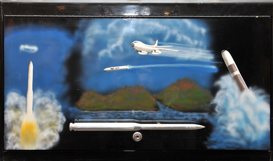 A detail of the artwork on the front of the toolbox painted by Don Jones in 1986 for a 341st Strategic Missile Wing team competing at Olympic Arena portrays the nuclear triad of land, air and sea. Jones recently visited the base and was surprised to find the toolbox on display at the base museum. (U.S. Air Force photo/John Turner)