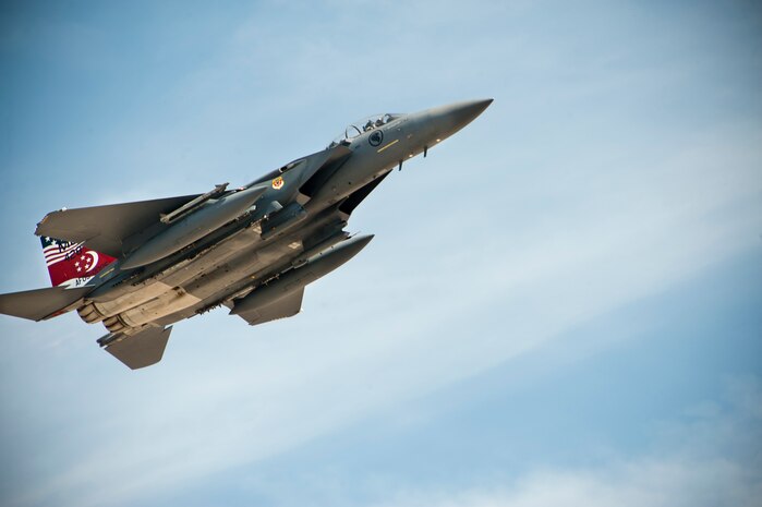 Republic of Singapore air force’s 428th Fighter Squadron’s flagship F-15SG aircraft assigned to the 366th Fighter Wing Mountain Home Air Force Base, Idaho, takes off for a Red Flag 14-3 training mission, July 18, 2014 at Nellis AFB, Nev. The 428th FS aircrews and support members are participating in their first Red Flag at Nellis AFB.  The 428th FS "Buccaneers" is the U.S. flagged flying squadron of the Peace Carvin V program, a long-term partnership with the Republic of Singapore. The squadron is dedicated to the training of Singaporean aircrew in the F-15SG, the country's newest fighter platform. The combined efforts of this program help ensure a strong U.S. relationship with Singapore, a critical partner in the region, while helping Singapore project airpower into the next generation. (U.S. Air Force photo by Lawrence Crespo)

