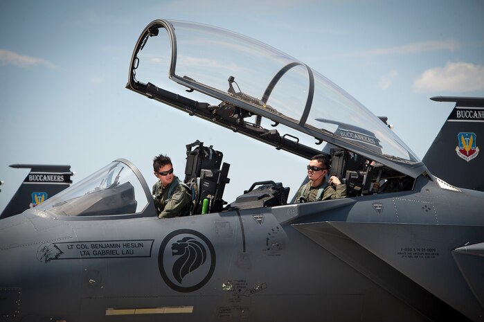 Republic of Singapore air force pilot and weapons officer assigned to the 366th Fighter Wing, 428th Fighter Squadron, Mountain Home Air Force Base, Idaho, perform preflight checks on an F-15SG aircraft prior to a Red Flag 14-3 training mission, July 18, 2014 at Nellis AFB, Nev. The RSAF’s participation in Red Flag builds international air force cooperation, interoperability, and mutual support. (U.S. Air Force photo by Lawrence Crespo)