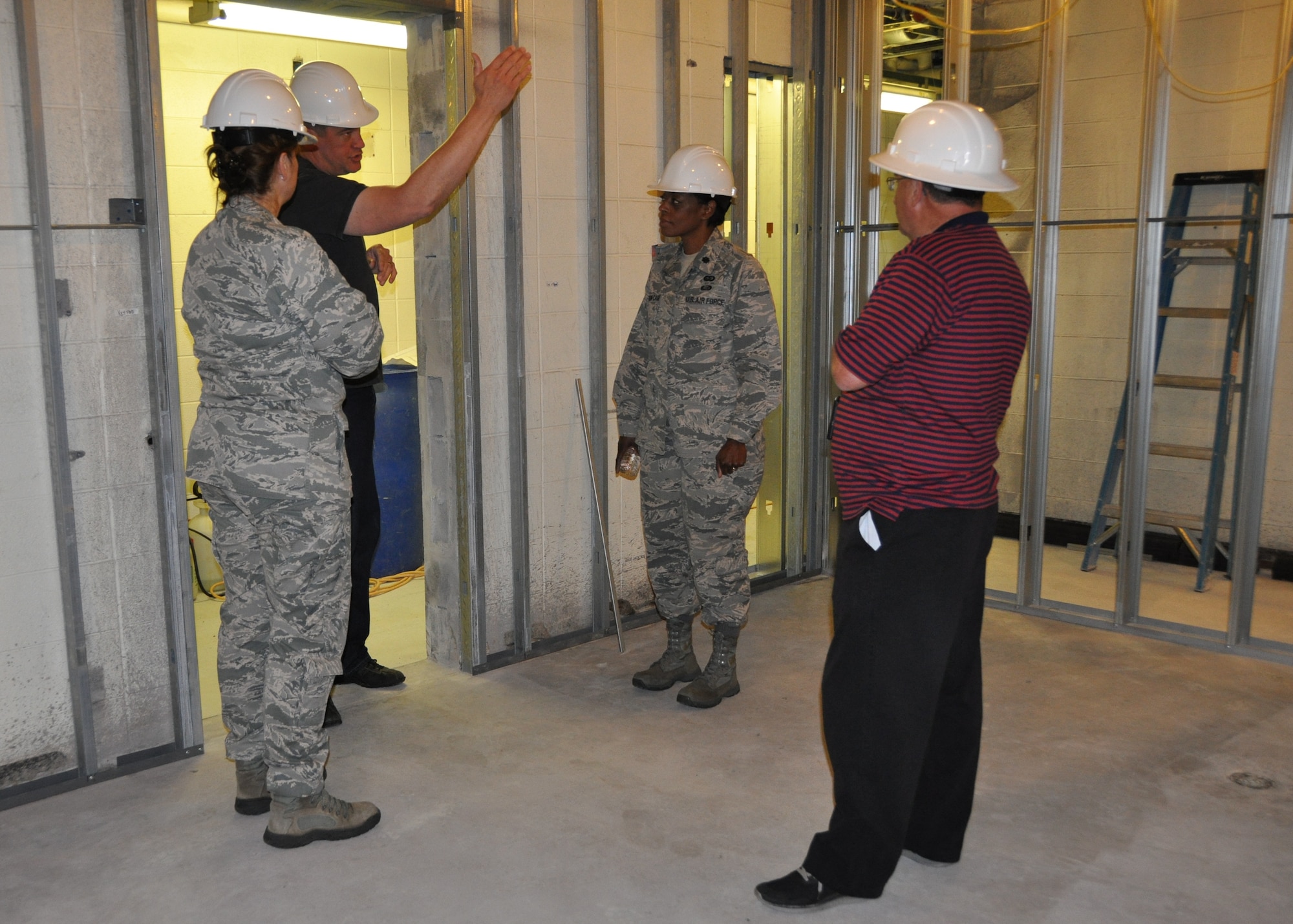 442d Fighter Wing senior leaders view progress being made in hangar 52 on Whiteman AFB, Mo.  The newly renovated offices will provide much needed space for several units across the wing. (U.S. Air Force photos by 1st Lt Jeff Kelly)