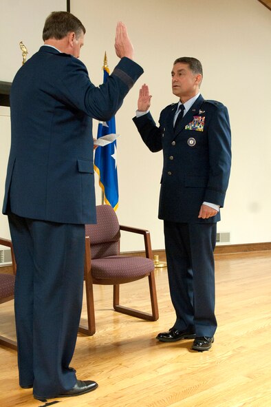 Maj. Gen. Edward W. Tonini (left), Kentucky’s adjutant general, administers the Oath of Office to Warren Hurst, assistant adjutant general for Air, during a ceremony promoting Hurst to the rank of brigadier general at the Kentucky Air National Guard Base in Louisville, Ky., July 12, 2014. Hurst previously served as commander of the Kentucky Air Guard’s 123rd Airlift Wing. (U.S. Air National Guard photo by Staff Sgt. Vicky Spesard)
