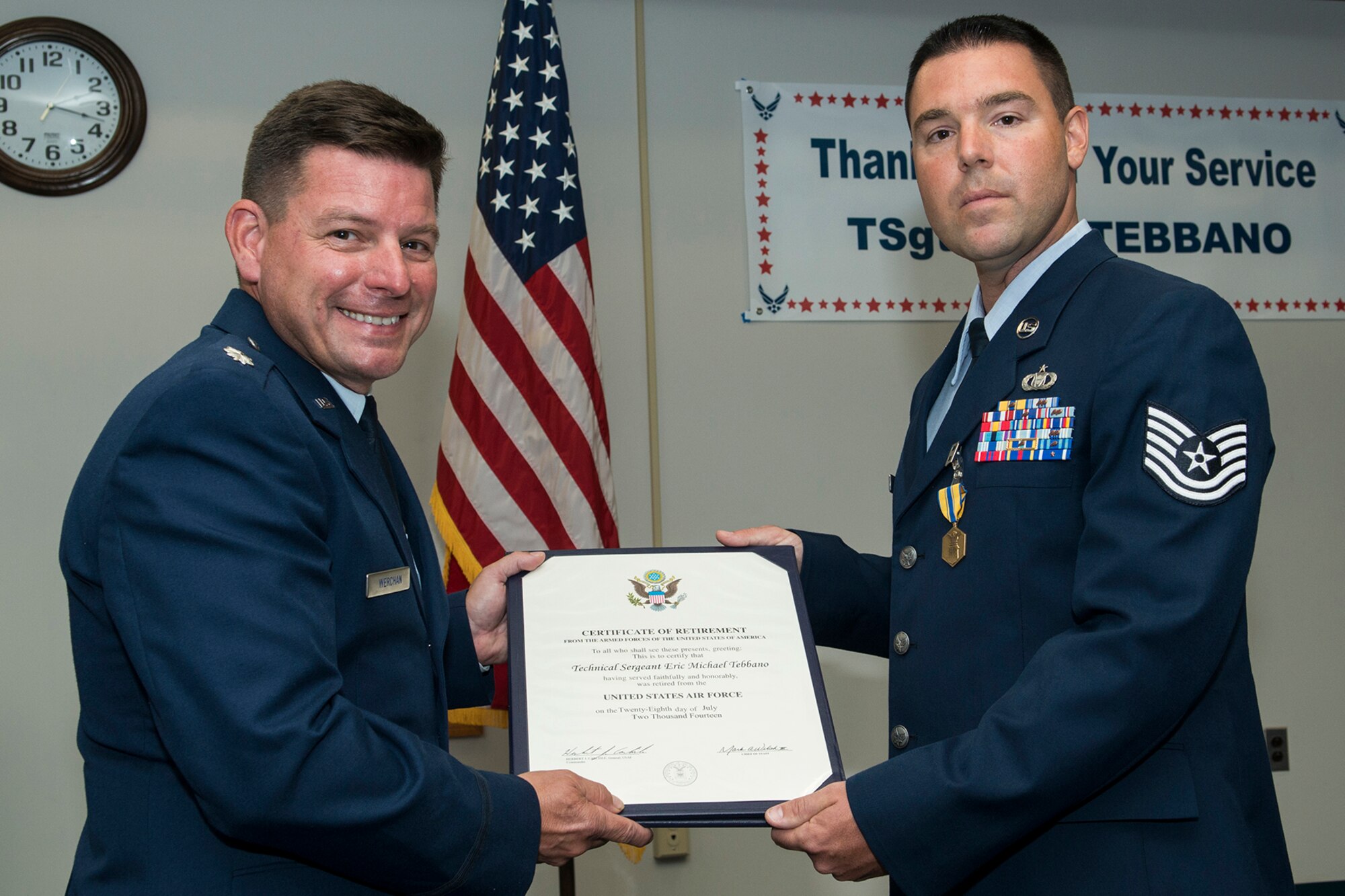 U.S. Air Force Lt. Col. Shawn Werchan presents the Certificate of Retirement to Tech. Sgt. Eric Tebbano during a ceremony on July 18, 2014, Barksdale Air Force Base, La. Tebbano is a Command and Control specialist and is retiring from the Air Force after 10 years of service. (U.S. Air Force photo by Master Sgt. Greg Steele/Released)