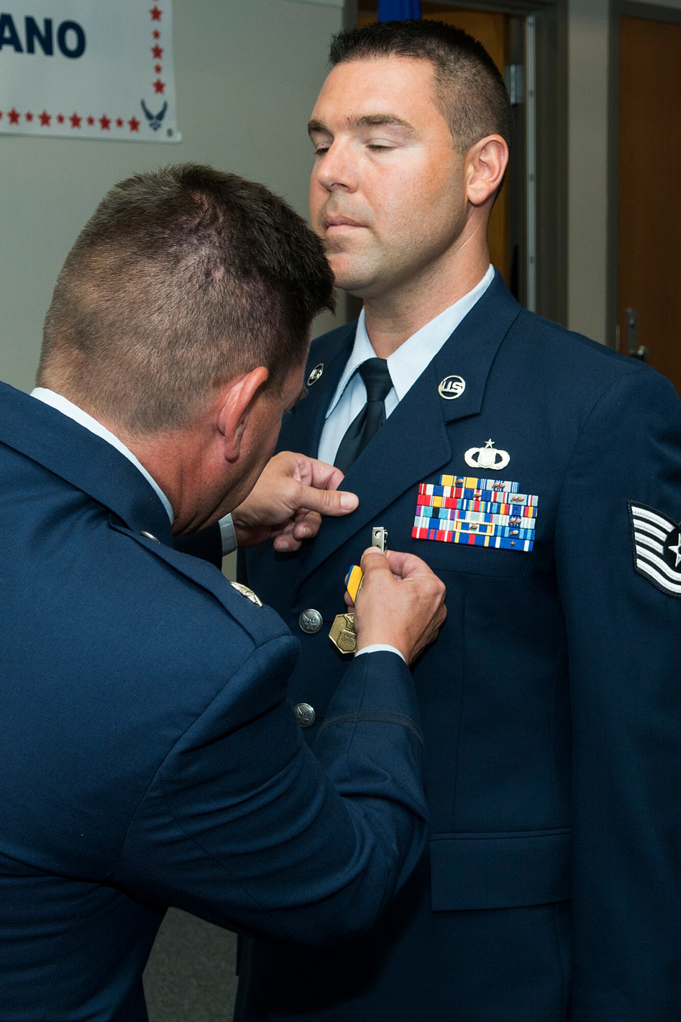 U.S. Air Force Tech. Sgt. Eric Tebbano is awarded the Air Force Commendation Medal during his retirement ceremony on July 18, 2014, Barksdale Air Force Base, La. Tebbano is a Command and Control specialist and is retiring from the Air Force after 10 years of service. (U.S. Air Force photo by Master Sgt. Greg Steele/Released)