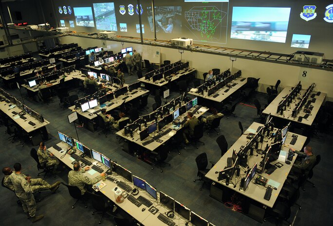 Members of the Air and Space Operations Center work during Red Flag 14-3 operations July 22, 2014, at Nellis Air Force Base, Nev. Armed with personnel from a wide variety of backgrounds to include flying, C2, intelligence, space and communications, AOC members at Nellis each have a specific task to fulfill in separate functional divisions ranging from combat operations to intelligence, surveillance, and reconnaissance. They are charged with providing operational-level C2 during large-force exercises such as Red Flag. (U.S. Air Force photo by Staff Sgt. Siuta B. Ika)