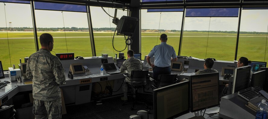 Airmen from the 23d Operation Support Squadron watch as an aircraft prepares to land at Moody Air Force Base, Ga., July 23, 2014. The control tower uses radar and a series of monitors to make sure it is safe to land before giving pilots the go ahead. (U.S. Air Force Airman 1st Class Alexis Millican/Released)