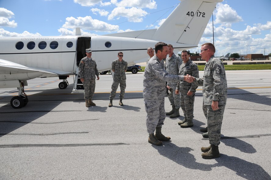 Chief Master Sgt. Tracy Troxel, 180th Fighter Wing Commander, greets Vice Chief of the National Guard Bureau, Lt. Gen. Joseph Lengyel, as he arrives for a short visit and tour of the 180th Fighter Wing. While visiting the Ohio-based Air National Guard unit, Lengyel received an up-close look at the wing’s best programs from green energy, Defense Support to Civil Authorities and the wing’s top performing Aerospace Control Alert mission. (Air National Guard Photo by Staff Sgt. Amber Williams/Released).