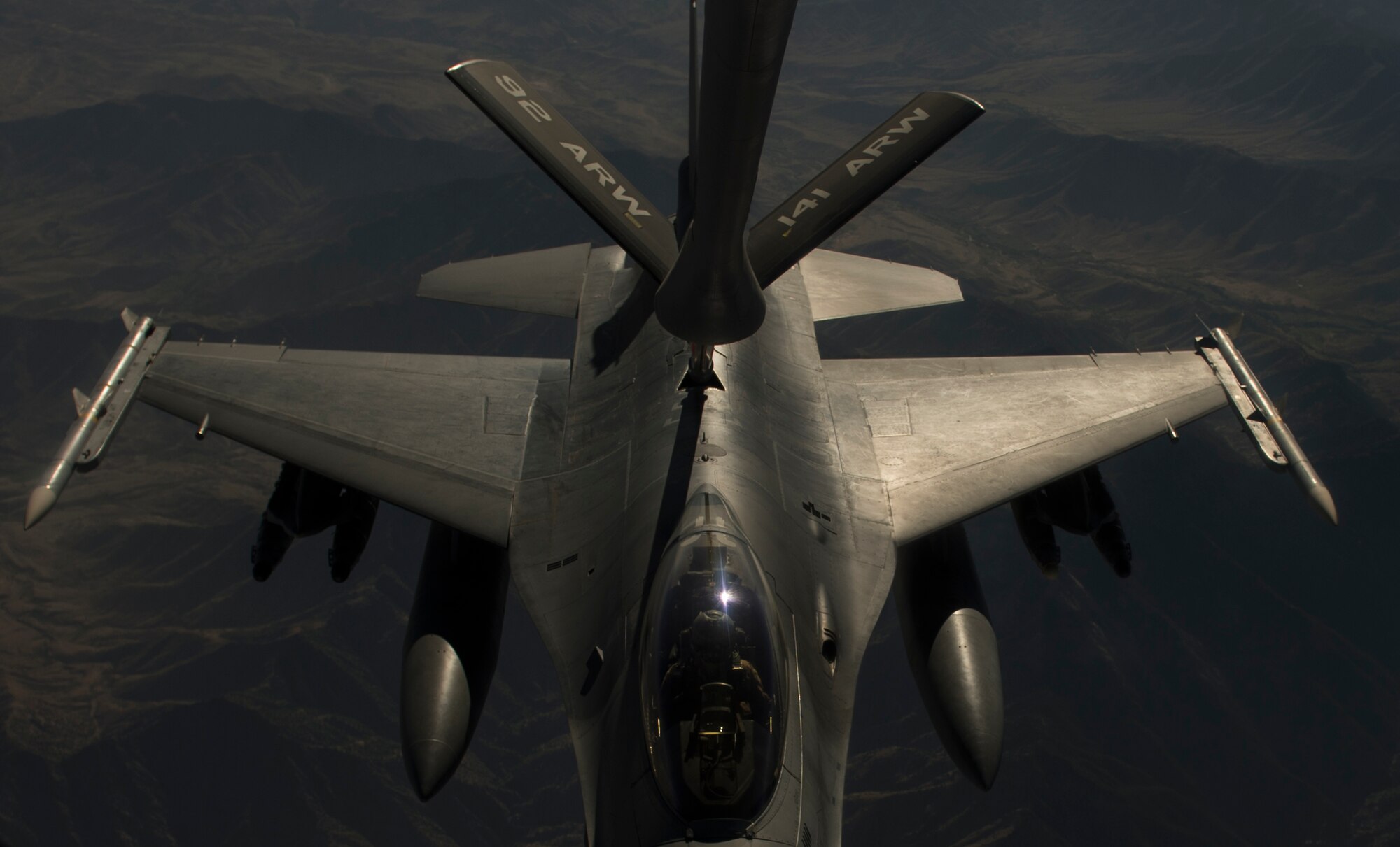 An F-16C Fighting Falcon receives fuel from a KC-135 Stratotanker during an in-air refueling mission over Afghanistan in support of Operation Enduring Freedom, July 22, 2014. The F-16 Fighting Falcon is a compact, multi-role fighter aircraft. It is highly maneuverable and has proven itself in air-to-air combat and air-to-surface attack. (U.S. Air Force photo by Staff Sgt. Vernon Young Jr./Released)