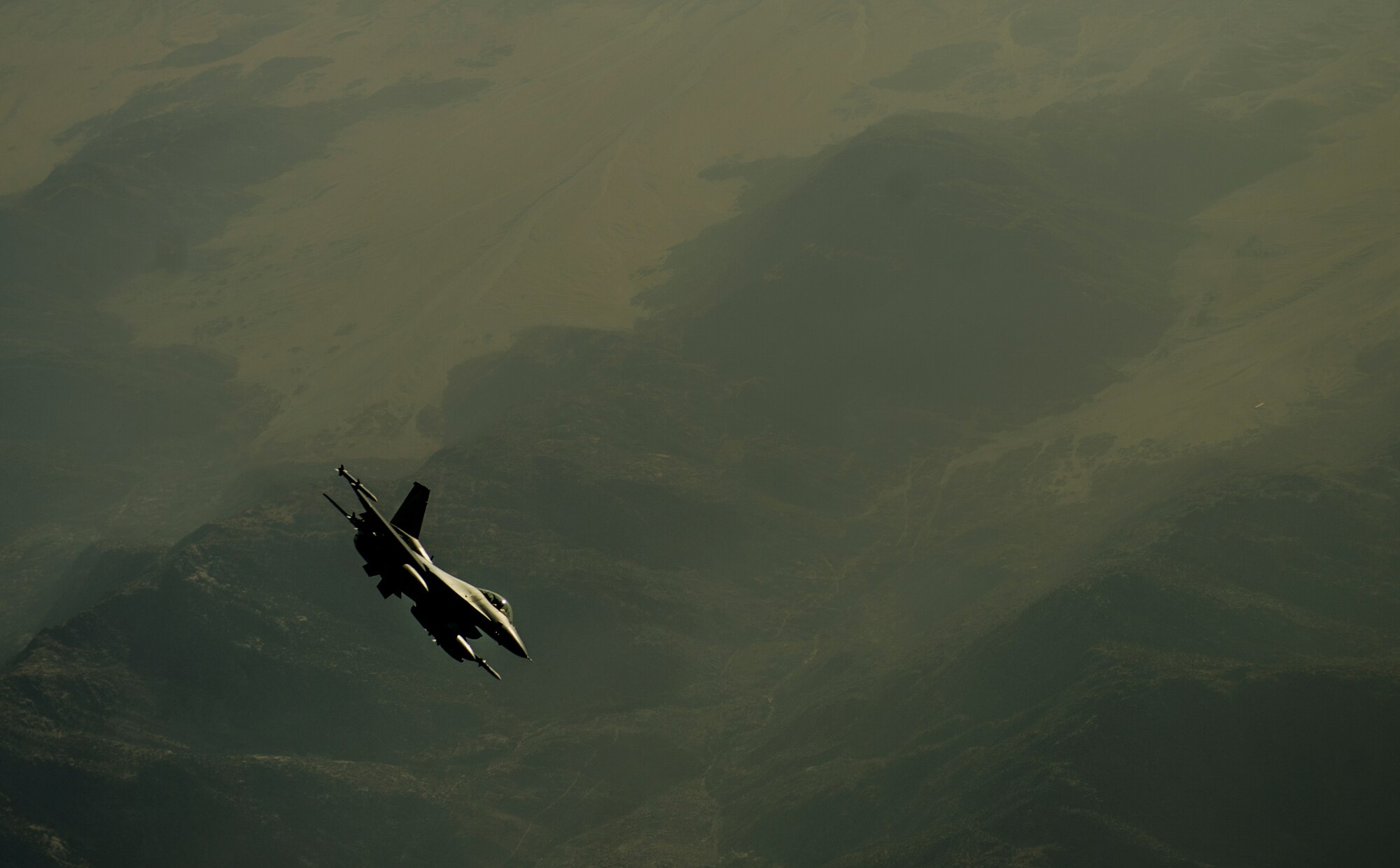 An F-16C Fighting Falcon flies over Afghanistan after an in-air refueling mission in support of Operation Enduring Freedom, July 22, 2014. The F-16 Fighting Falcon is a compact, multi-role fighter aircraft. It is highly maneuverable and has proven itself in air-to-air combat and air-to-surface attack. It provides a high-performance weapon system for the United States and allied nations. (U.S. Air Force photo by Staff Sgt. Vernon Young Jr./Released)