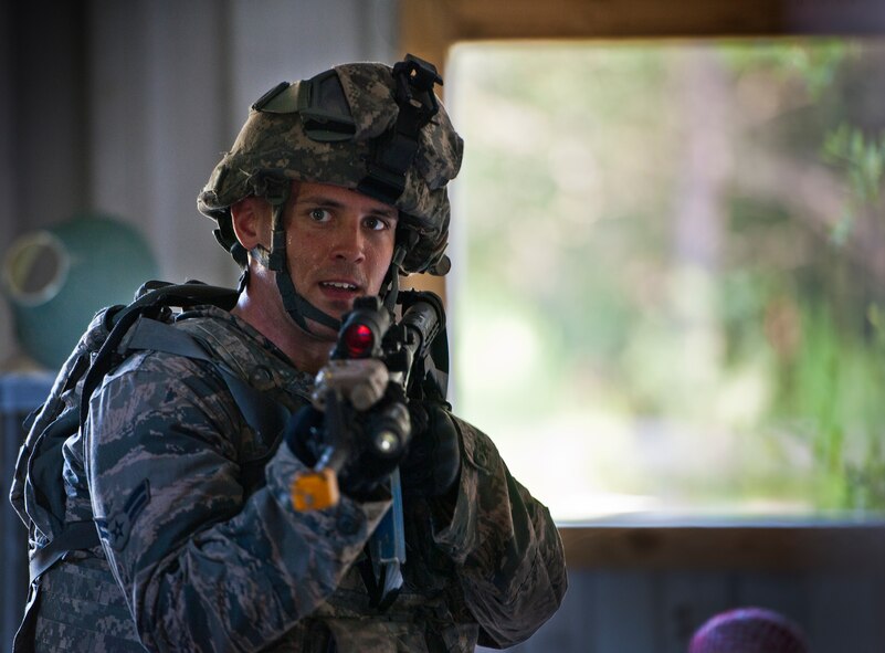 A Security forces Airman moves through a building during a village raid at the conclusion of their three-day field training exercise at Eglin Air Force Base, Fla., July 22.  The exercise is the culmination of the base’s last six-week security forces deployment training course known as Brave Defender and administered by the 96th Ground Combat Training Squadron.  The squadron will be officially deactivated Oct. 1 and the mission will move to Fort Bliss, Texas.  (U.S. Air Force photo/Samuel King Jr.)