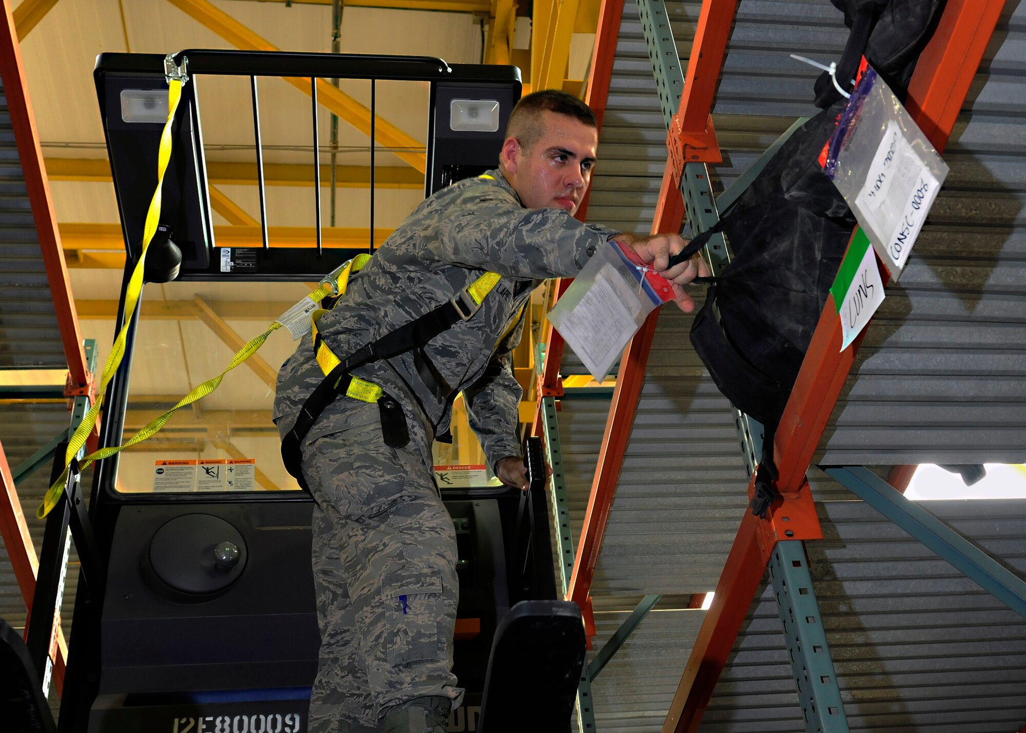 Airman 1st Class Jacob Lape, 39th Logistics Readiness Squadron material management journeyman, sorts mobility bags at the mobility warehouse July 22, 2014, Incirlik Air Base, Turkey. Mobility bags are kept on stand-by at all times in case of emergency. (U.S. Air Force photo by Staff Sgt. Eboni Reams/Released)