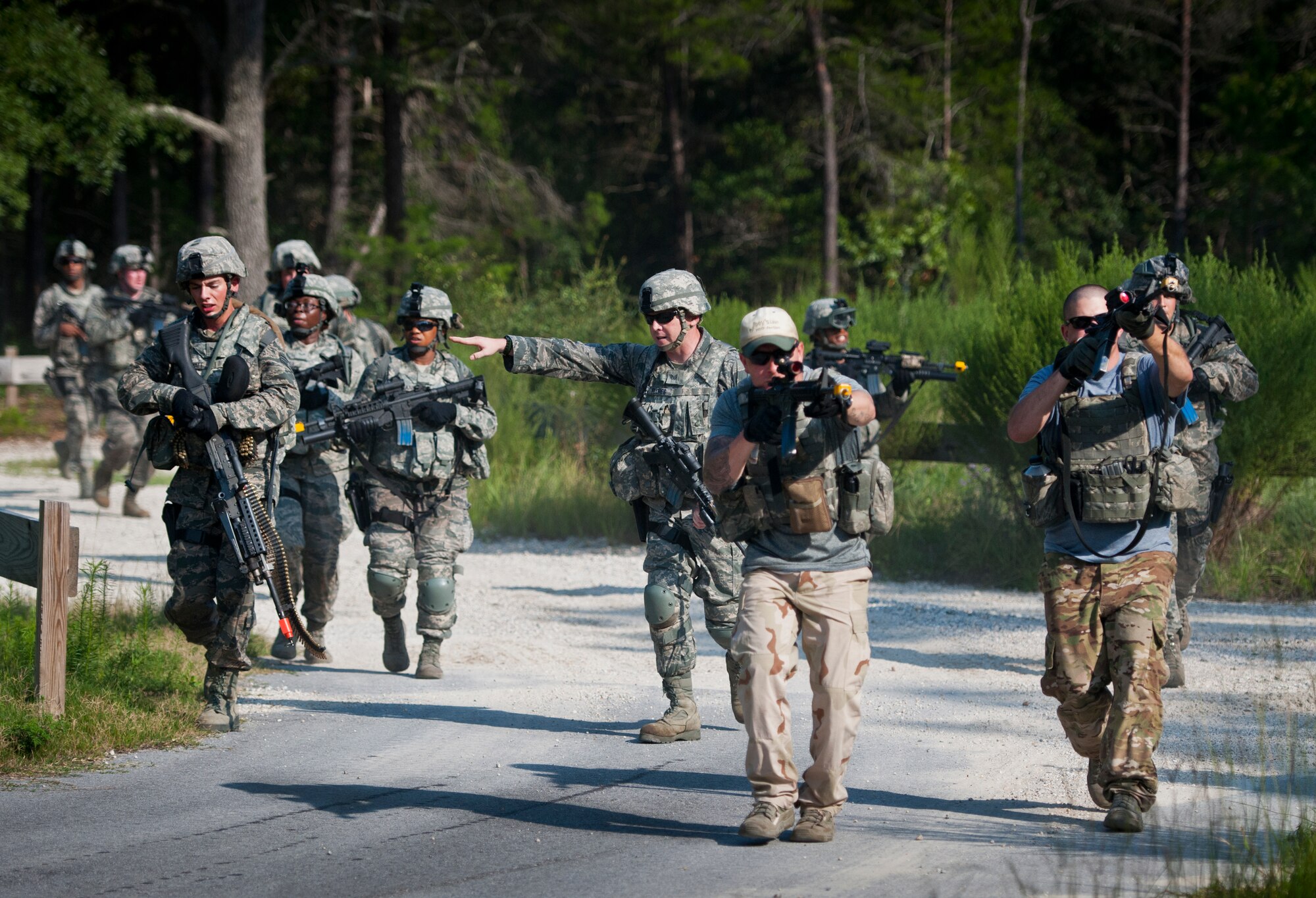 Security forces Airmen sweep into a village on foot during a raid at the conclusion of their three-day field training exercise at Eglin Air Force Base, Fla., July 22.  The exercise is the culmination of the base’s last six-week security forces deployment training course known as Brave Defender and administered by the 96th Ground Combat Training Squadron.  The squadron will be officially deactivated Oct. 1 and the mission will move to Fort Bliss, Texas.  (U.S. Air Force photo/Samuel King Jr.)