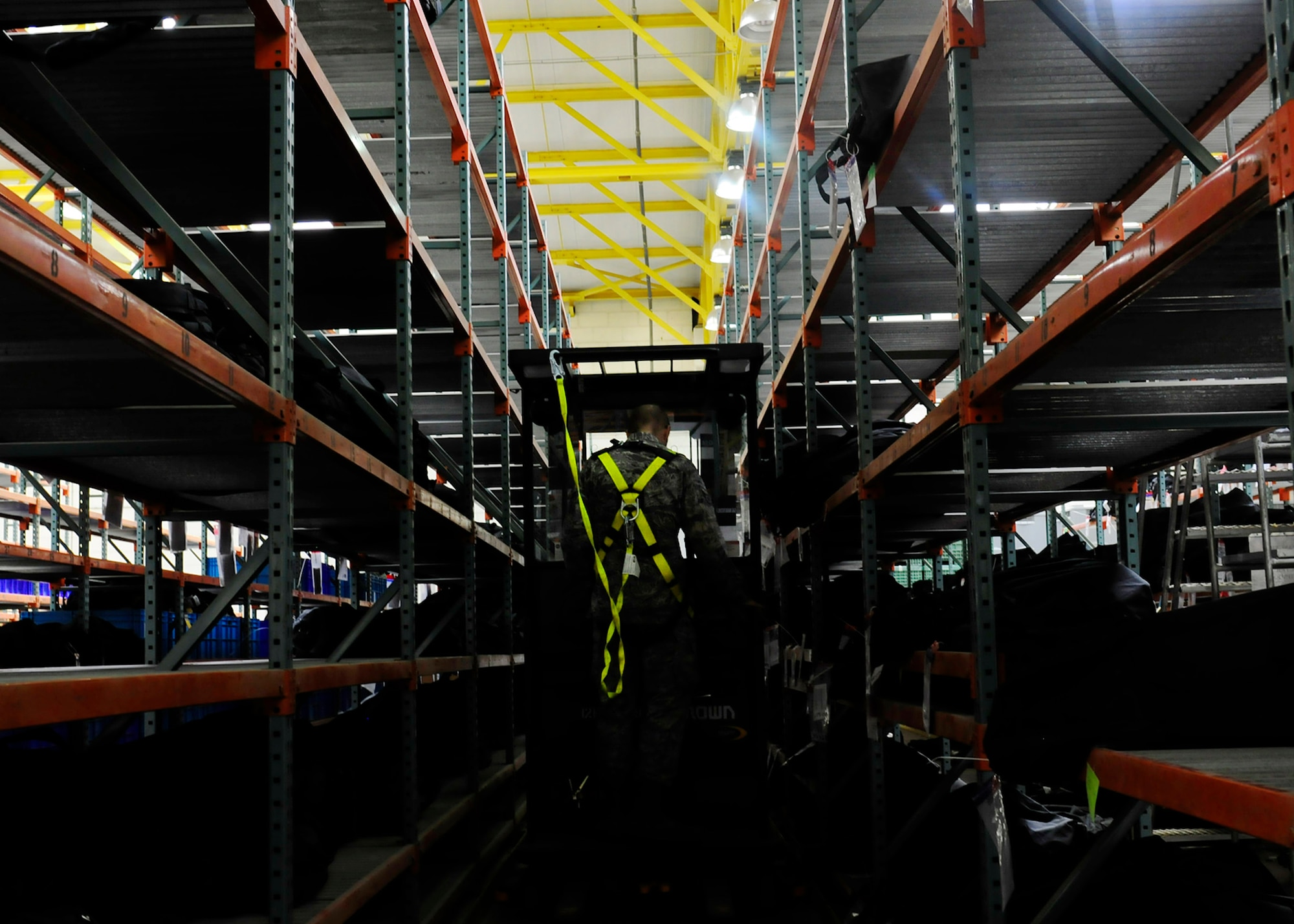 Airman 1st Class Jacob Lape, 39th Logistics Readiness Squadron material management journeyman, organizes mobility bags by unit at the mobility warehouse July 22, 2014, Incirlik Air Base, Turkey. Individual mobility bags are always ready for use. (U.S. Air Force photo by Staff Sgt. Eboni Reams/Released)