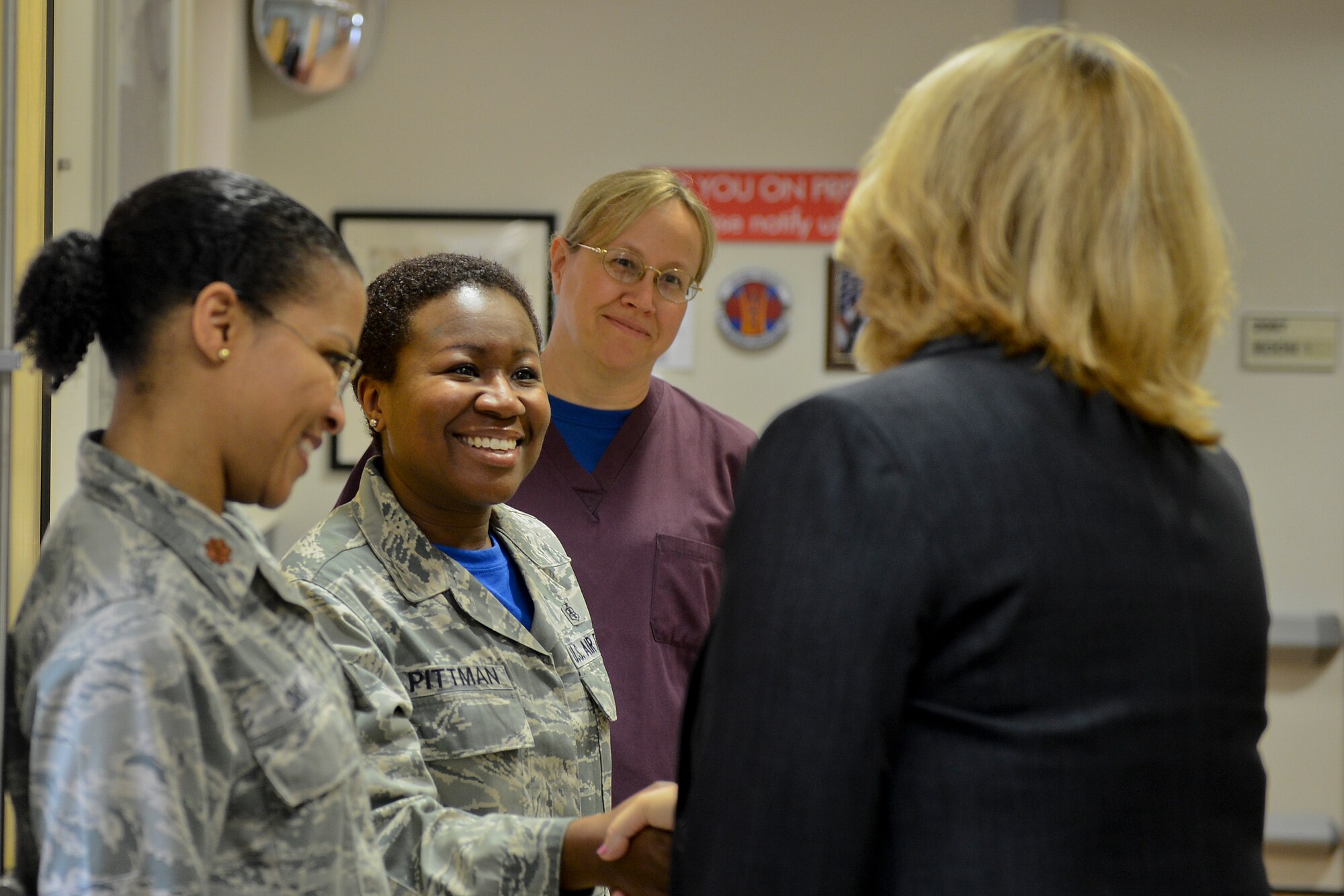 Secretary of the Air Force Deborah Lee James greets Tech. Sgt. Tiffany Pittman, 48th Inpatient Operations Squadron, center, Maj. Tania Sims, 48th IPTS, left, and Capt. Annette Stephens, 48th IPTS, right, during a visit to the hospital at Royal Air Force Lakenheath, England, July 18, 2014. As part of her top priority to take care of people, James visited the award-winning hospital to talk with 48th Medical Group members whose very mission is the care of people every day. (U.S. Air Force photo by Airman 1st Class Trevor T. McBride/Released)