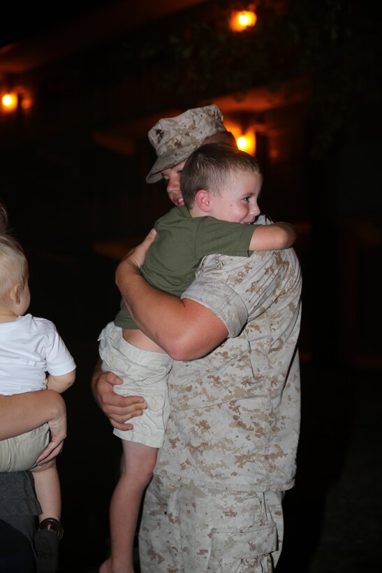 Corporal Zachary Beckwith hugs his four-year old son after returning to Marine Corps Air Station Cherry Point July 24, 2014, following a four-month deployment to Morón Air Base, Spain, in support of Special Purpose Marine Air-Ground Task Force Crisis Response. Beckwith is a semitrailer refueler operator with Marine Wing Support Squadron 271.


