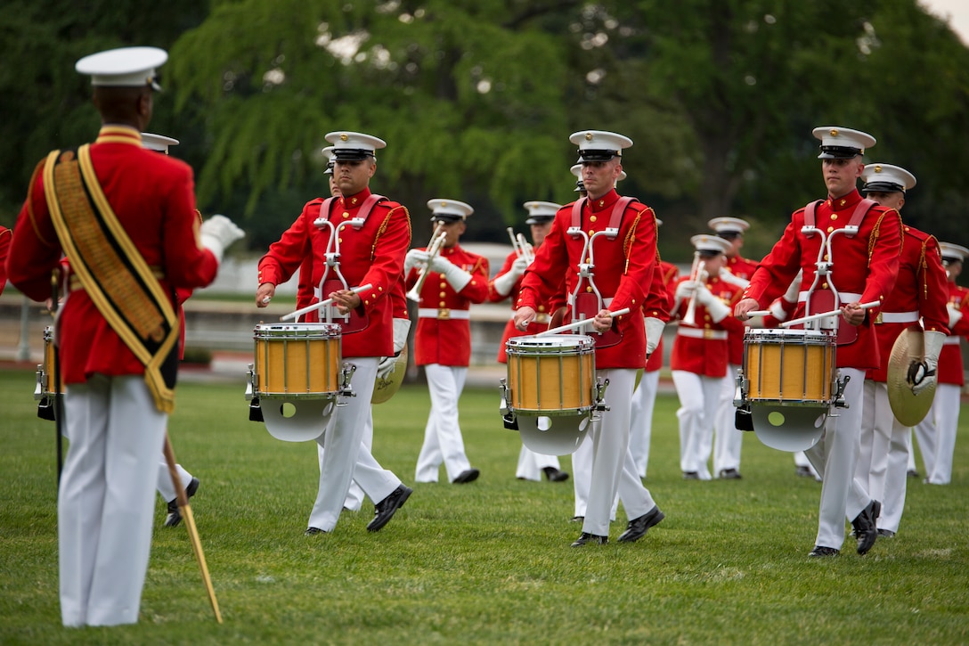 The United States Marine Drum & Bugle Corps performs during a parade at Worden Field at the United States Naval Academy in Annapolis, Md., July 24. (Official Marine Corps photo by Cpl. Larry Babilya/Released)