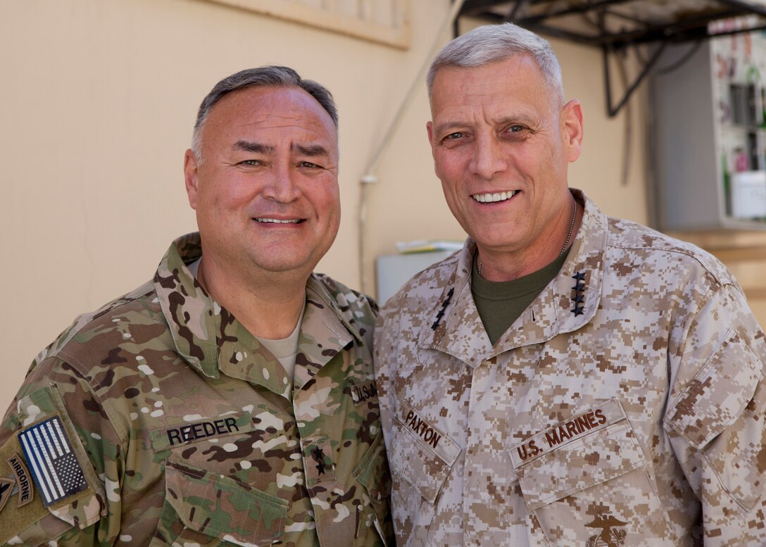 The Assistant Commandant of the Marine Corps, Gen. John M. Paxton, Jr., right, poses for a photo with U.S. Army Maj. Gen. Reeder at Camp Integrity in Kabul, Afghanistan, July 19, 2014. (U.S. Marine Corps photo by Cpl. Tia Dufour/Released)