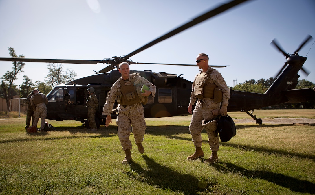 The Assistant Commandant of the Marine Corps, Gen. John M. Paxton, Jr., left, and Col. James Glynn, arrive at the International Security Assistance Forces Headquarters in Kabul, Afghanistan, July 19, 2014. (U.S. Marine Corps photo by Cpl. Tia Dufour/Released)
