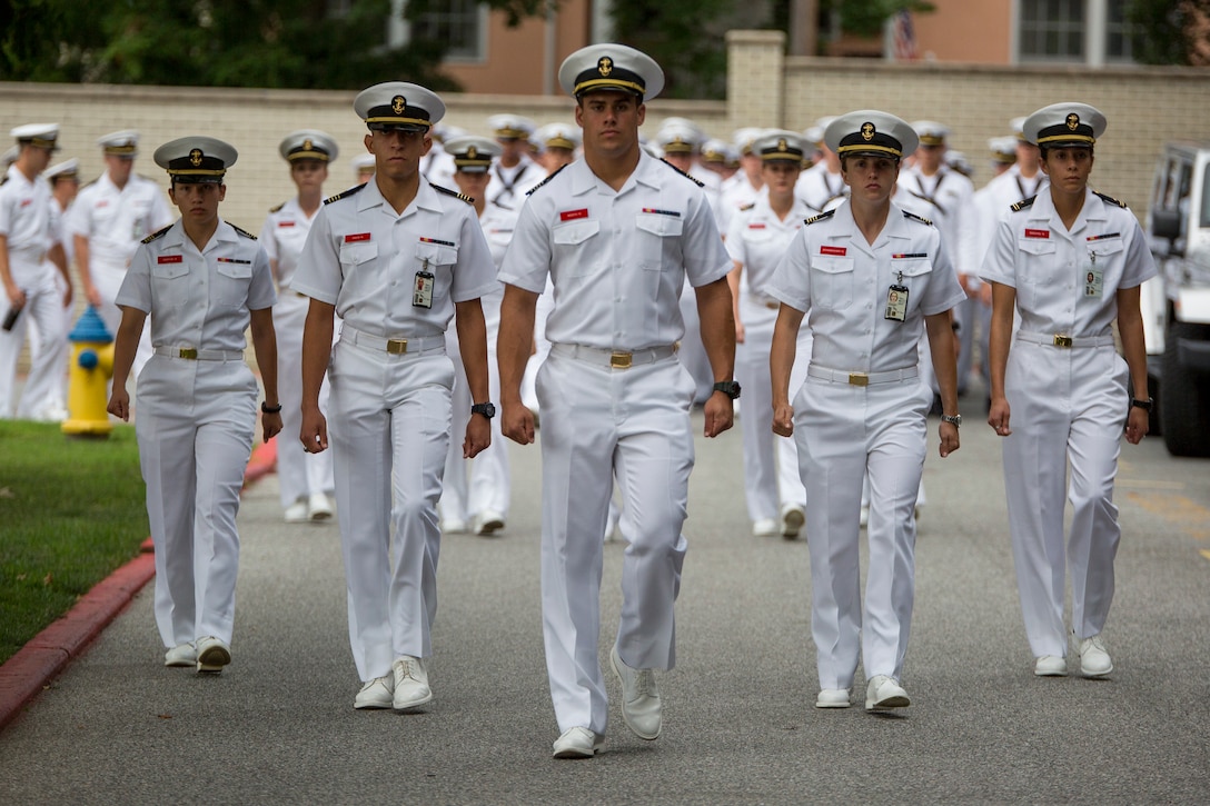 Midshipmen from the United States Naval Academy march to watch a parade at Worden Field at the USNA in Annapolis, Md., July 24.(Official Marine Corps photo by Cpl. Larry Babilya/Released)