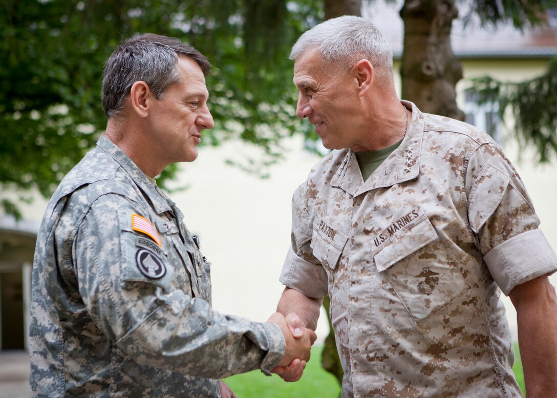 The Assistant Commandant of the Marine Corps, Gen. John M. Paxton, Jr., right, visits with U.S. Army BG Linder in Stuttgart, Germany, July 22, 2014. Gen. Paxton visted with United States Africa Command; Special Operations Command Africa, and Marine Forces Europe. (U.S. Marine Corps photo by Cpl. Tia Dufour/Released)