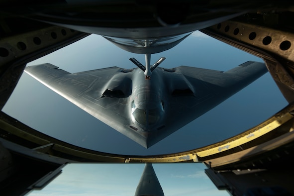 A B-2 Spirit flies into position June 11, 2014, during a refueling mission over the North Atlantic Ocean. The B-2 is conducting training flights and regional familiarization in the U.S. European Command area of operations. The B-2 is a multi-role bomber capable of delivering both conventional and nuclear munitions. (U.S. Air Force photo/Tech. Sgt. Paul Villanueva II)