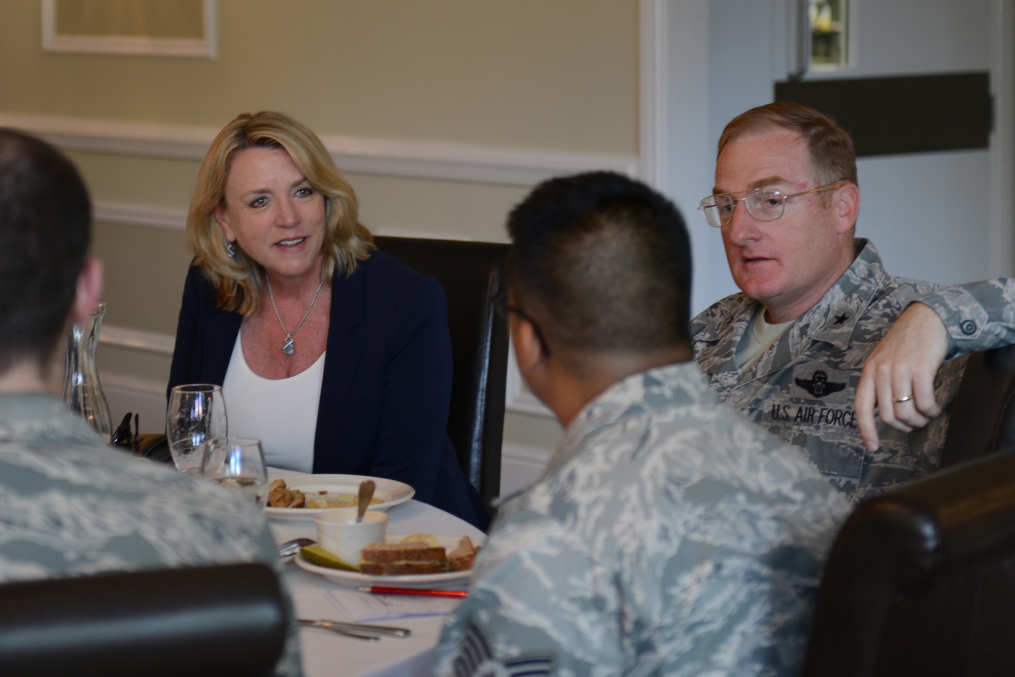Secretary of the Air Force Deborah Lee James and Brig. Gen. Douglas Cox speak with Airmen from the 501st Combat Support Wing at lunch July 17, 2014, during a visit to Royal Air Force Alconbury, England. More than fifty Airmen had the chance to sit and speak with James during lunch, explaining their parts of the mission of the 501st CSW. Cox is the director of U.S. Air Forces in Europe-United Kingdom. (U.S. Air Force photo/Tech. Sgt. Chrissy Best)