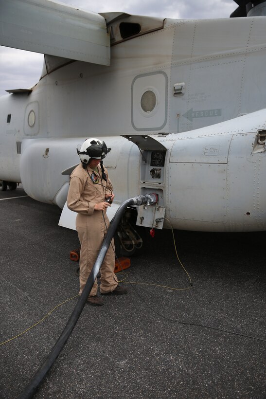 Lance Cpl. Jodi Esp, a crew chief with Marine Medium Tiltrotor Squadron (VMM) 166 monitors gas refueling for an MV-22B Osprey at the Grand Canyon, July 24. The Grand Canyon was the turning point during a training exercise with VMM-166.