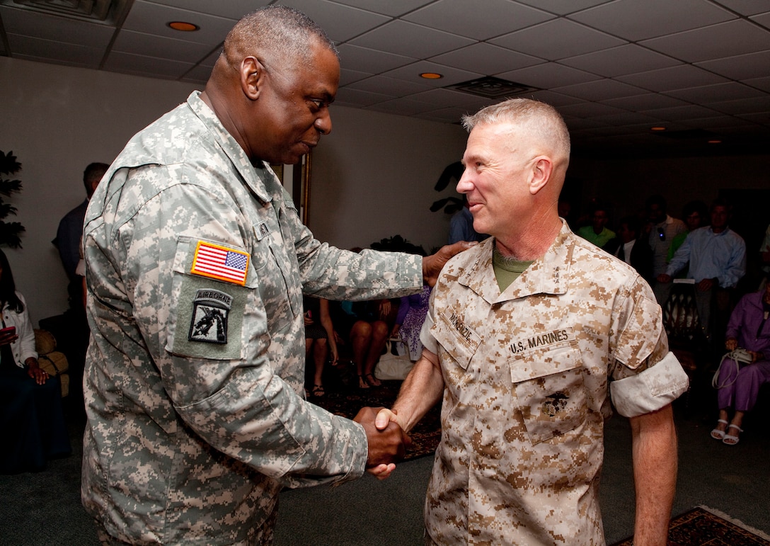 MACDILL AIR FORCE BASE, Fla. – Army Gen. Lloyd J. Austin III, commander of U.S. Central Command, welcomes Lt. Gen. Kenneth McKenzie back to USCENTCOM before a change of command ceremony here June 18.  McKenzie assumed command of U.S. Marine Corps Forces Central Command from Lt. Gen. Robert Neller during a change of command ceremony, June 18. (USCENTCOM photo by Sgt. Fredrick J Coleman, USMC)

