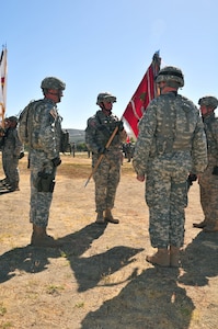 Army Lt. Col. Zac Delwiche, commander of the California Army National Guard's 578th Brigade Engineer Battalion, receives the unit guidon during the activation ceremony for the unit at Camp Roberts, California, June 14, 2014. The 578th BEB is the first brigade engineer battalion to be activated in the Army National Guard and part of an Army-wide change to provide greater organic engineer support to brigade combat teams. 