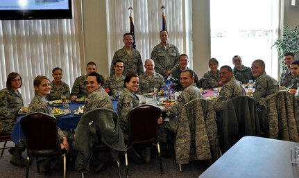 Command Chief Master Sgt. Christopher E. Muncy, command chief of the Air National Guard, prepares to eat lunch and talk with 15 members of the 128th Air Refueling Wing's enlisted Airmen in Milwaukee on January 8, 2012. Muncy was at the 128 ARW as part of a tour of all the Air National Guard bases located in Wisconsin.