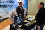 Russ Knocke, director of marketing and communications for Arizona State University, speaks with an Army National Guard member Jan. 6, 2012, at the Army National Guard Readiness Center in Arlington, Va.