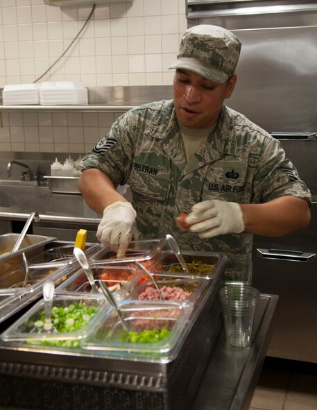 U.S. Air Force Tech. Sgt. Juan Beltran, 7th Force Support Squadron, measures vegetables July 24, 2014, at Dyess Air Force Base, Texas. Beltran prepares vegetables for an omelet ordered during breakfast. The dining facility offers expanded dining choices to include a Mongolian grill, UFood, pizza bar, deli and fruit smoothies. There is also a ‘Simply-to-Go’ section with sandwiches and other snacks prepared ahead of time for faster service. (U.S. Air Force photo by Senior Airman Shannon Hall/Released) 