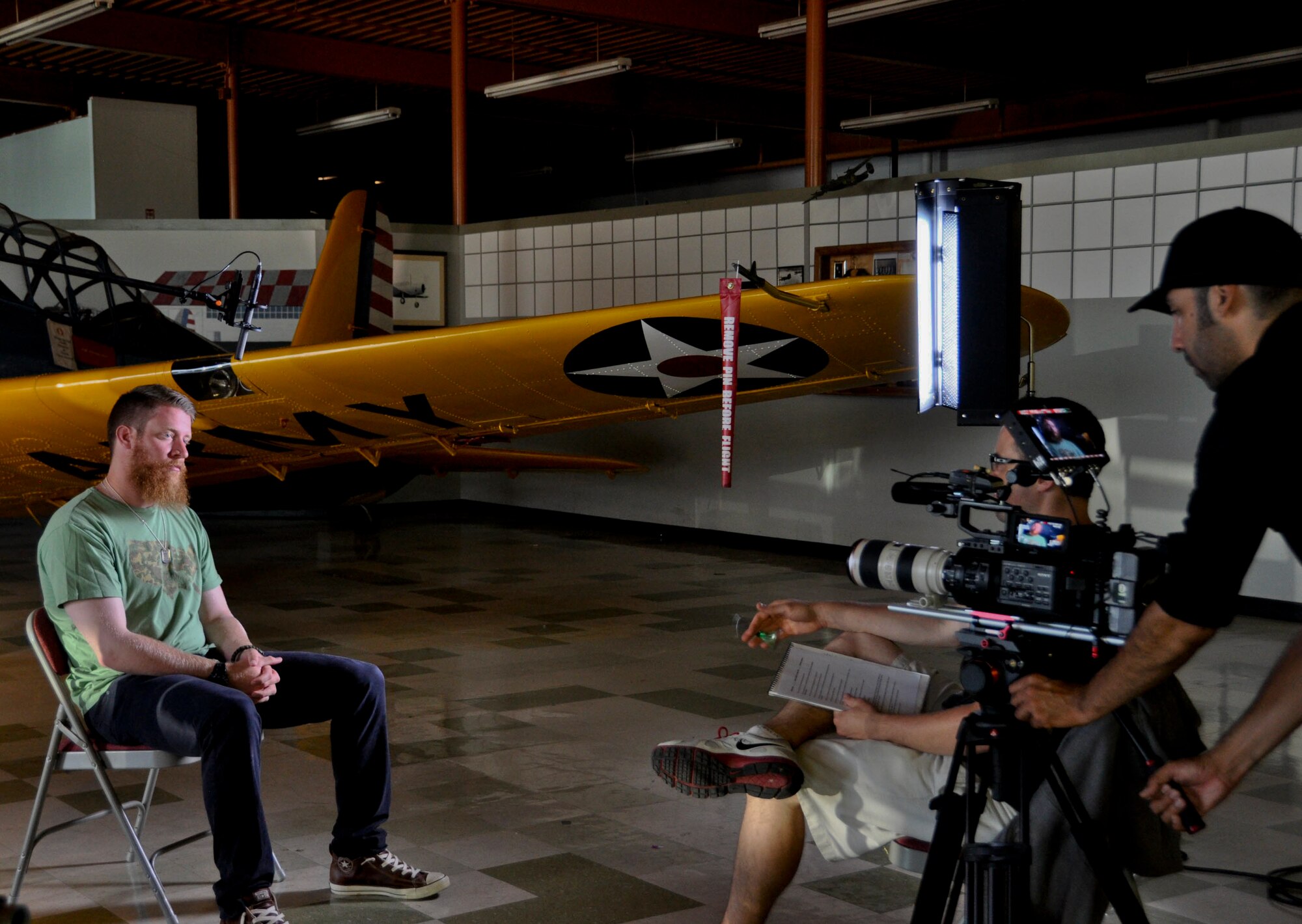 Sean Doolittle,  Oakland A's pitcher, does an interview for the MLB network July 21 at the Travis Air Force Base Heritage Museum. Doolittle visited the Heritage Museum during his tour of Travis. (U.S. Air Force photo by Airman 1st Class Amber Carter)