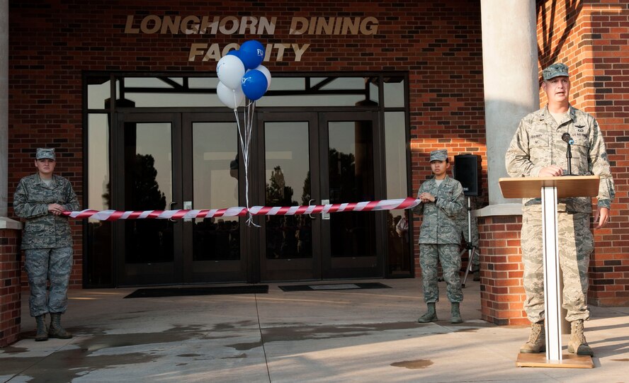 U.S. Air Force Col. Steven Beasley, 7th Bomb Wing vice commander, speaks at the dining facility grand reopening July 24, 2014, at Dyess Air Force Base, Texas. The Longhorn Dining Facility was closed for nine months to upgrade to the Food Transformation Initiative, an Air Force-wide initiative to improve food options provided to Airmen. (U.S. Air Force photo by Senior Airman Shannon Hall/Released) 