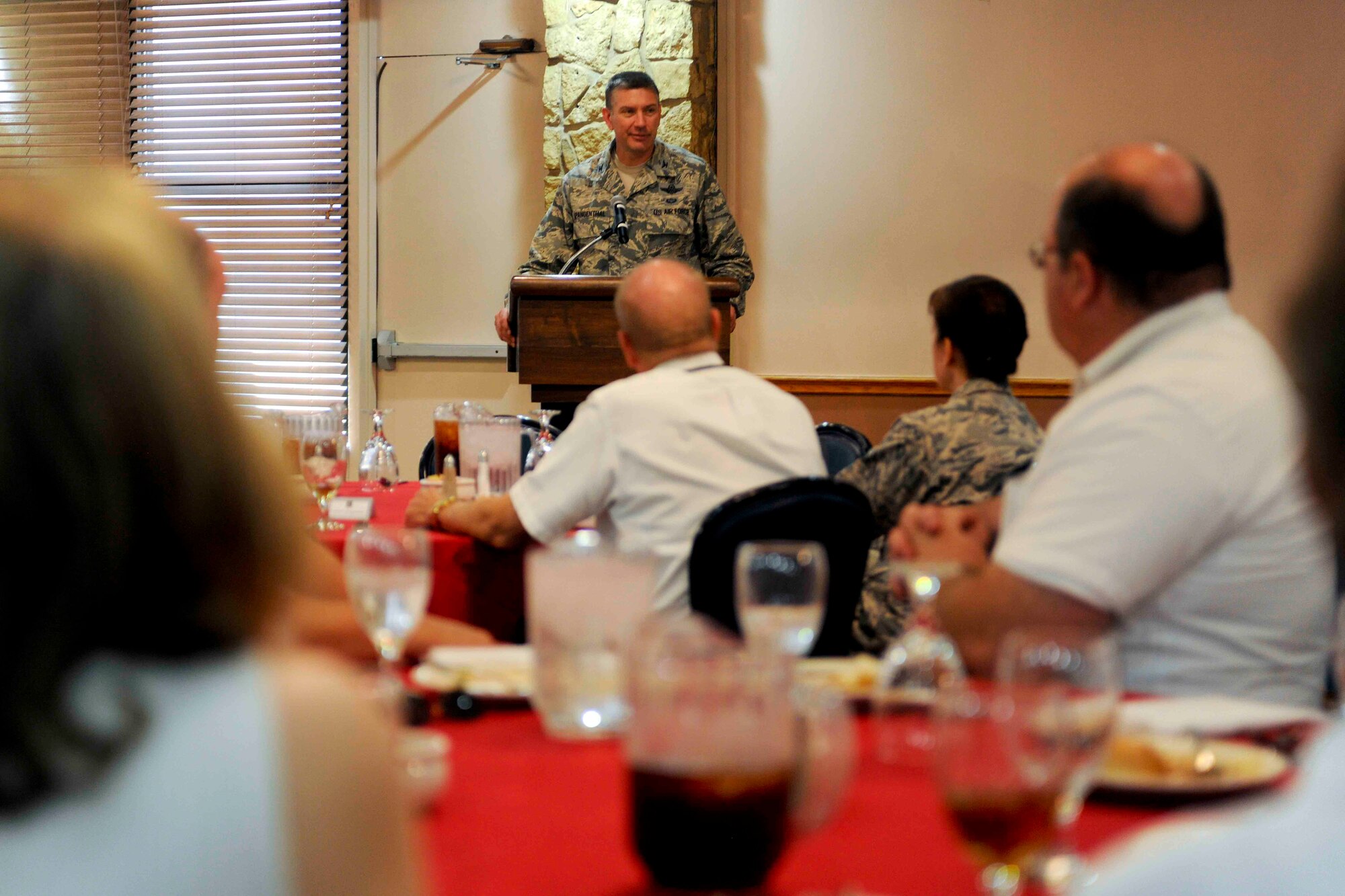 U.S. Air Force Col. Bill Spangenthal, 97th Air Mobility Wing commander speaks to graduates of a leadership class as part of the Altus Civilian Training and Development program July 25, 2014. The program provides tools for civilians to lead in offices on base and build professional relationships on base. (U.S. Air Force photo by Senior Airman Jesse Lopez/Released)